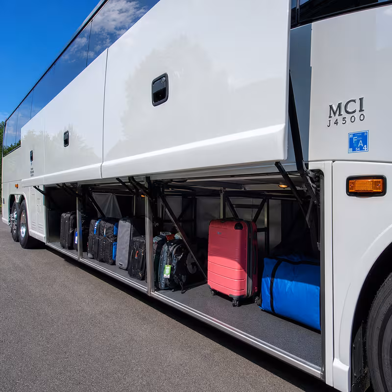 Party bus interior with wraparound leather seating and LED lighting in Morristown