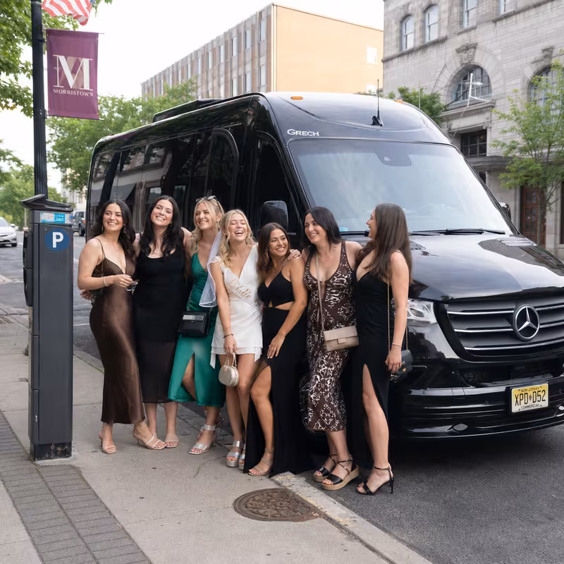 Group boarding a white charter bus for Bachelor & Bachelorette Transportation transportation in Morristown