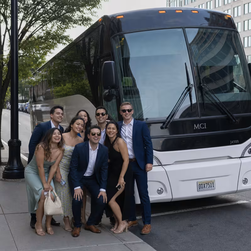 Passengers loading luggage while boarding an Morristown group shuttle