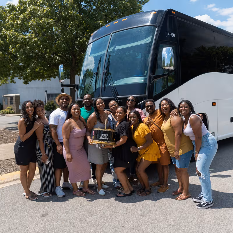 Passengers loading luggage while boarding an Morristown group shuttle