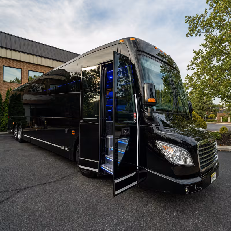 Party bus interior with wraparound leather seating and LED lighting in Morristown