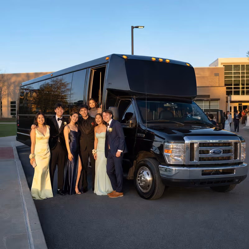 Group boarding a white charter bus for Prom & Homecoming Transportation transportation in Morristown