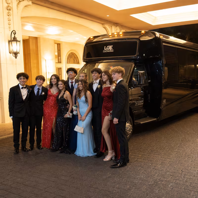 Party bus interior with wraparound leather seating and LED lighting in Morristown